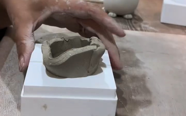 Karen Wiltshire shaping clay in the Prop Options sphere split mould