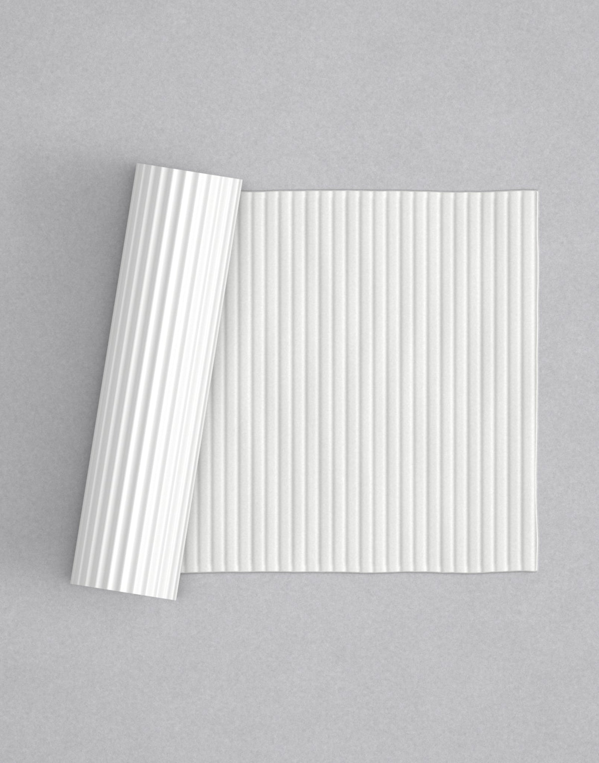 No.12 Wide Reed mini 4" texture rolling pin with its pattern rolled out on white fondant - Prop Options