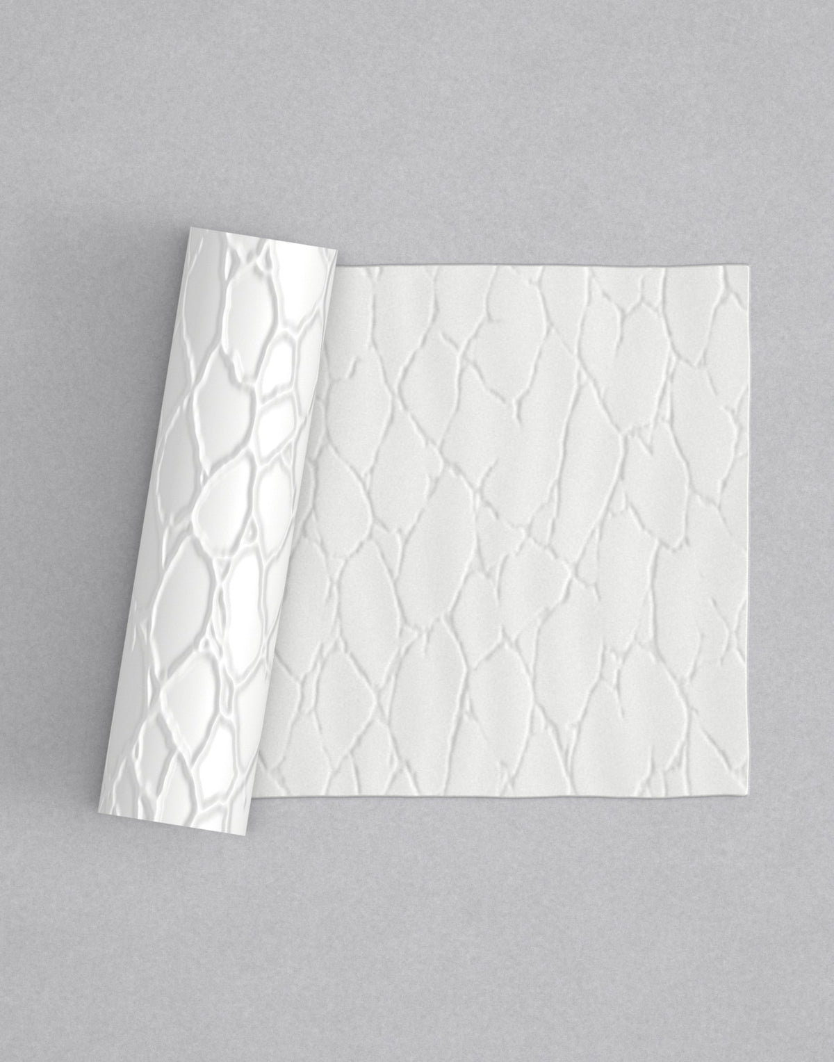 No.55 Fractura mini 4" texture rolling pin with its pattern rolled out on white fondant - Prop Options